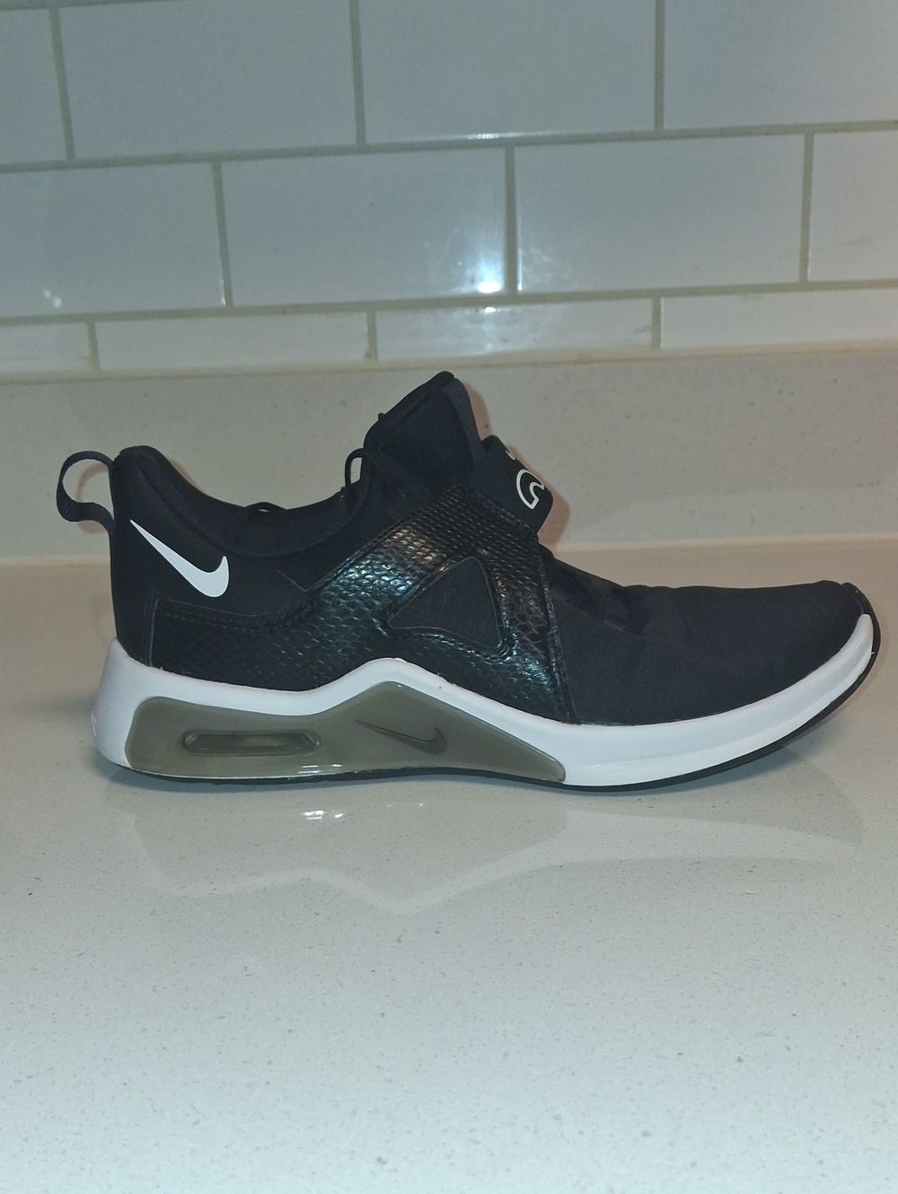 Nike Air Bella 5 Tr Women's Black and White Slip-On Athletic Sneaker